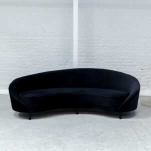 Curved black velvet sofa