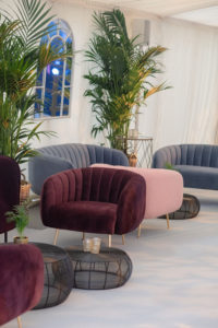 Armchairs and coffee tables at an event