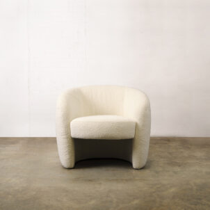 White boucle tubby armchair with round armrests