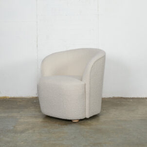 Ivory boucle curved armchair for event hire on white background